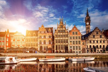 Obraz premium Ghent city historical center, tourists boats and colorful buildings on Leie river bank, Belgium