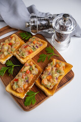 Sandwiches with guacamole and salsa on a wooden board isolated on a white background. Top view.