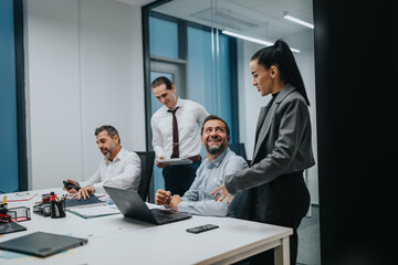 A diverse group of professionals collaborates in a bright, modern office.