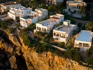 Obraz premium Aerial View of Cala Santanyí: Turquoise Cove and Beach Resort on Mallorca's Mediterranean Coast
