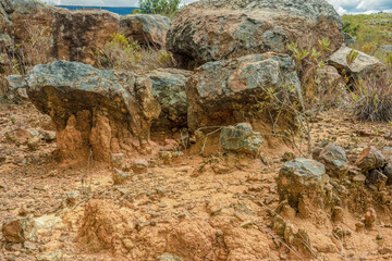 The stone formation and erosion of the desert ground; landscape view captured in the La Candelaria desert, in the eastern Andean mountains of central Colombia, near the town of Raquira.