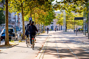 People on bicycles in Copenhagen , popular mode of transport in Denmark. Life on streets Scandinavian city.   © Tomasz
