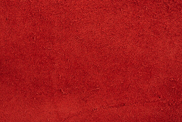 Red suede textured macro photo as background.