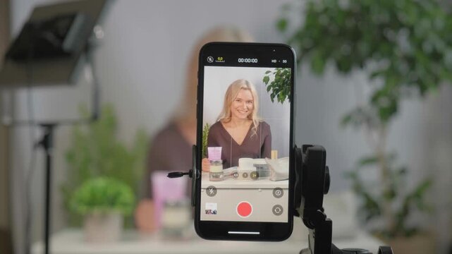 Face, makeup influencer or vlog with girl, spray or advice with content creator, promotion for cosmetics product or live streaming. Portrait, person or woman with item for skincare or record tutorial