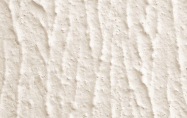 Cream concrete wall texture background. Uneven render stucco white painted concrete wall texture background. Rough and grunge wall.