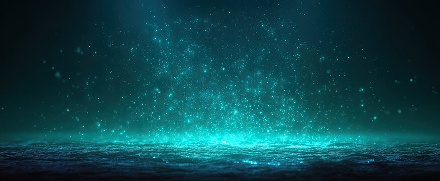 Abstract teal glowing particles on dark surface