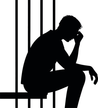 A solitary silhouette of a person sits dejectedly behind prison bars.