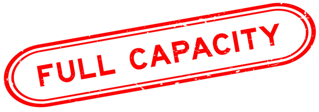 Grunge red full capacity word rubber seal stamp on white background