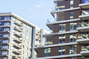 Luxury apartment towers with glass balconies and mixed architectural styles in Belgrade Waterfront district. Concept of upscale urban development, premium real estate, and metropolitan expansion.