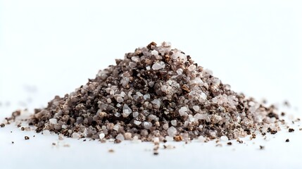 Pile of gourmet black salt with pink Himalayan salt crystals mixed together on white background, perfect for culinary photography.