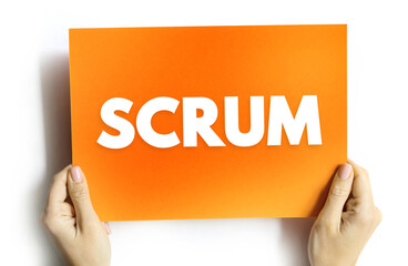 SCRUM text on card held by hands. Agile project management concept representing teamwork, iterative planning, development cycles, and efficient collaboration
