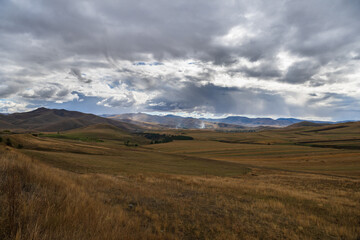 Scenic autumn landmark with field and mountains, Armenia