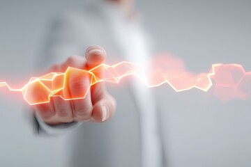 Close up of a person in a gray suit touching a glowing orange futuristic holographic interface on a light gray background demonstrating digital technology innovation