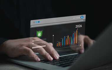 Secure business analytics dashboard on laptop showing data growth trend 2021–2026. Professional monitoring financial performance, cybersecurity, and future investment forecast.