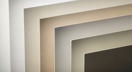 Abstract color palette of layered paper sheets in neutral earth tones.
A sleek, high-detail abstract image showcasing a fanned arrangement of layered sheets of paper or cardstock