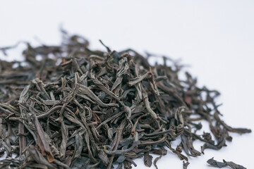 Close-Up of Loose Leaf Black Tea Pile Isolated on a White Background