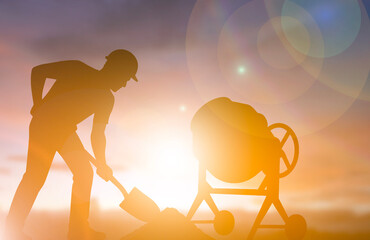Construction worker mixing cement with shovel silhouette