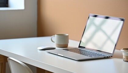 Modern Laptop on White Desk with Mug and Mouse in Bright Office Setting