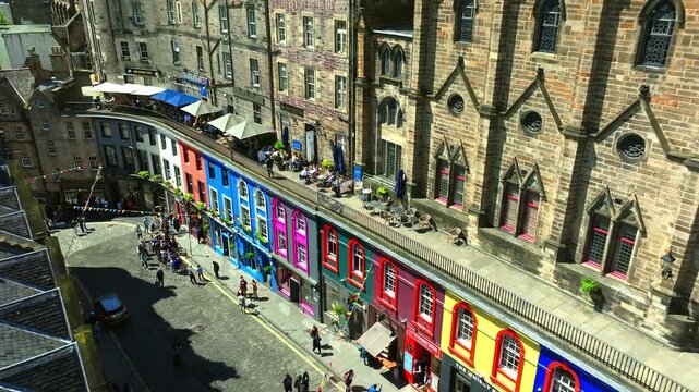 Colorful Victoria Street in Edinburgh with Tourists and Shops
