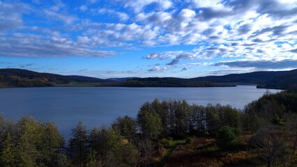 Peaceful calm lake in morning sunlight aerial view in Pennsylvania countryside