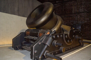 An ancient ship's mortar. An artillery piece with a short barrel designed for mounted firing at...