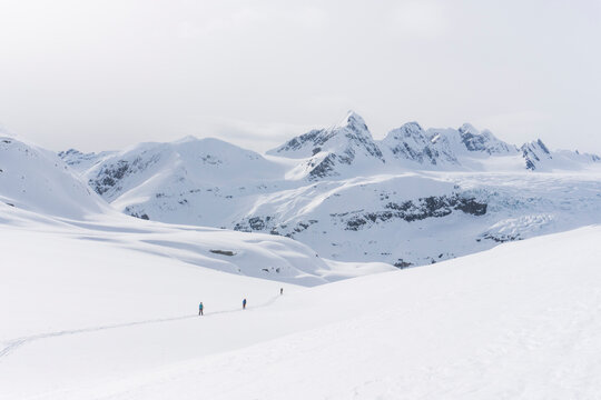 Skiers enjoy a backcountry tour in the Northern Rockies of British Columbia, Canada.
