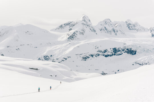 Skiers enjoy a backcountry tour in the Northern Rockies of British Columbia, Canada.