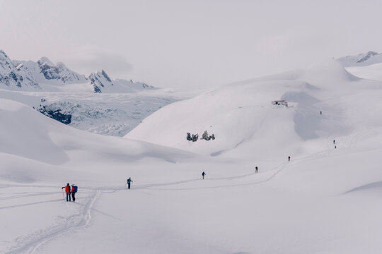 Skiers enjoy a backcountry tour in the Northern Rockies of British Columbia, Canada.