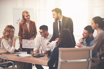 Group of coworkers working together in office