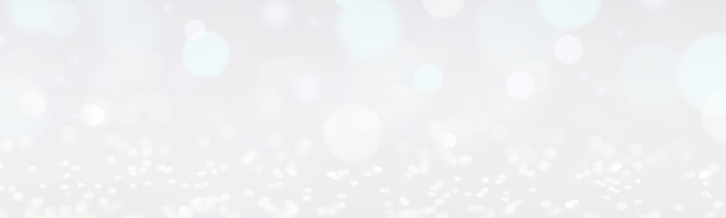 Christmas background with white glitters and bokeh lights. Banner design