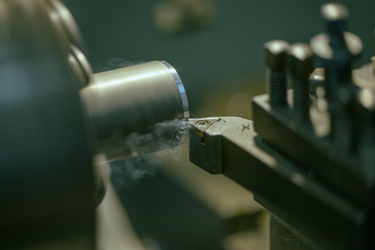 Close up on metalwork automated computer numerical control machine.