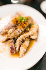 Stir-fried mantis shrimp or crayfish with garlic topping. Thai style seafood