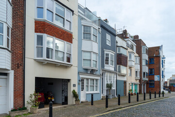 A row of houses in Old Portsmouth, Bath square, with the Portsmouth Sailing Club in the background