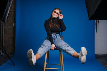 Stylish confident woman, Fashionable lady sitting confidently