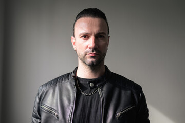 Portrait Of A Mature Man In Leather Jacket Looking at Camera