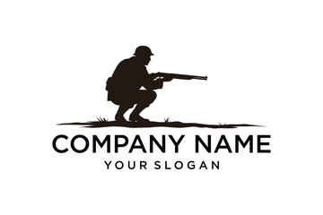 Silhouette of a hunter or soldier in helmet crouching with a shotgun, isolated on white with ground and grass details, perfect for logos and branding.