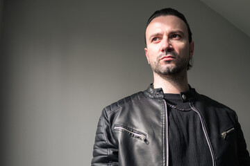 Portrait Of A Mature Man In Leather Jacket Studio Shot