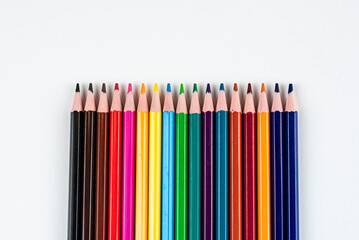 Vibrant Row Of Colored Pencils In Rainbow Spectrum For Art, Education, And Creativity