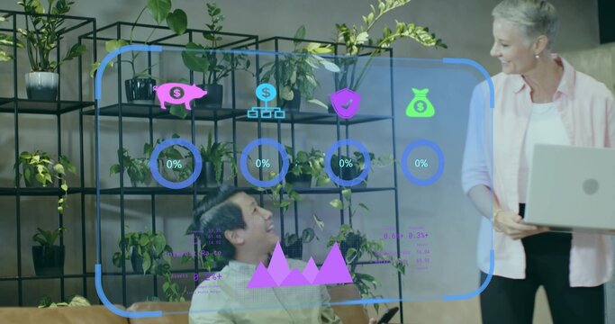 Colleagues holding smartphone and typing on laptop in office lounge with shelving and AR dashboard - Powered by Adobe