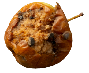 Rotten apple decomposing on dirt ground nature