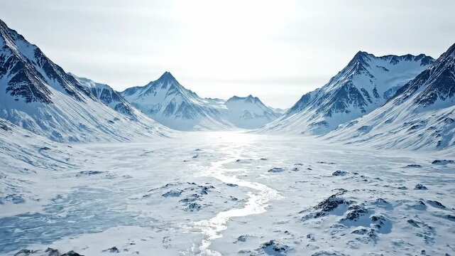 A majestic winter valley filled with snow and ice stretches towards the distant mountains under a bright sky