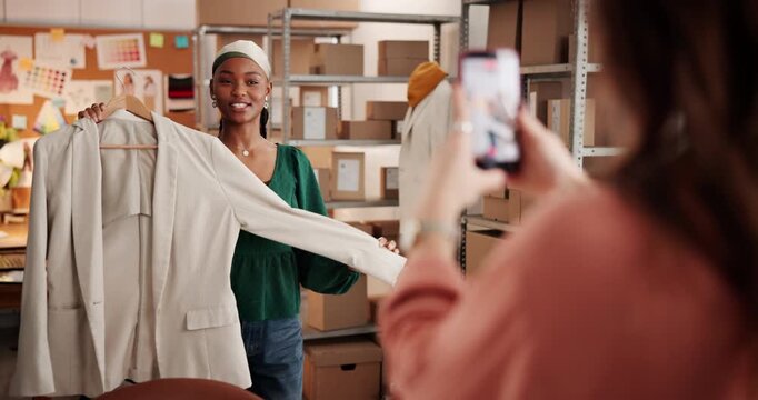 Filming, woman and fashion influencer with clothes for live streaming review with ecommerce business. Boxes, vlogging and content creator with stylish jacket for outfit ideas online in workshop.