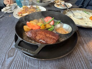 Grilled steak with vegetables and mustard sauce served on pan
