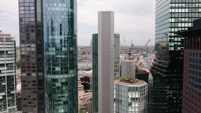 Horizontal flyby in Frankfurt&rsquo;s Mainhattan district, traversing modern office towers and high-rises that represent Germany&rsquo;s leading role in European economics, business, and city innovation.
