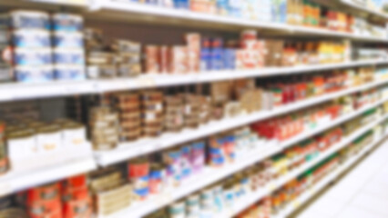 Abstract blur image of supermarket background. Shelves with products. Grocery store. Retail industry. Rack. Inflation concept. Aisle. Consumer packaged goods. CPG. Shopping. Delivering. Supply chain.