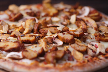Gyros Pizza with with champignons and mozzarella cheese. Wooden background. Soft focus.	