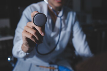 Homecare nursing service and elderly people cardiology healthcare. Close up of young hispanic female doctor nurse check mature caucasian man patient heartbeat using stethoscope during visit