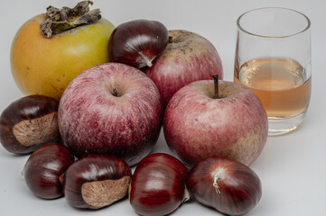 A composition of typically autumnal fruits such as chestnuts, persimmons or the Campanian Annurca apple, enhancing their beauty and detail.