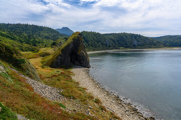 Mountainous coastline along the tranquil waters of the Russian shoreline