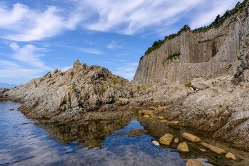 Beautiful coastal rocks by Russia's calm sea on a sunny day